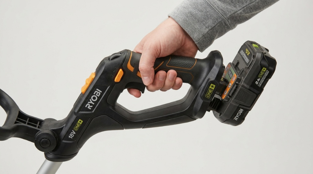 Close-up of a cordless trimmer control handle and adjustable battery slot.